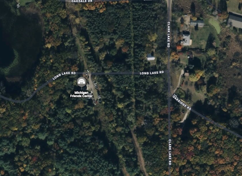 An aerial view of the Michigan Friends Center with labels marking nearby roads: Long Lake Rd, Clark Lake Rd., and Oak Ridge Rd.